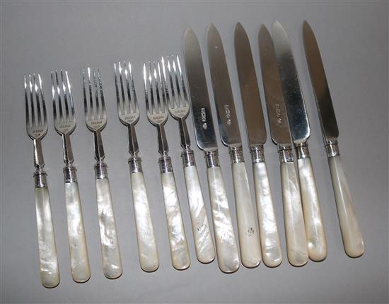 Twelve pairs of Edwardian silver dessert eaters, mother of pearl handles, London 1901.